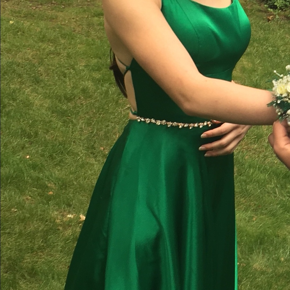 Sherri Hill Satin Green Gown with open back.